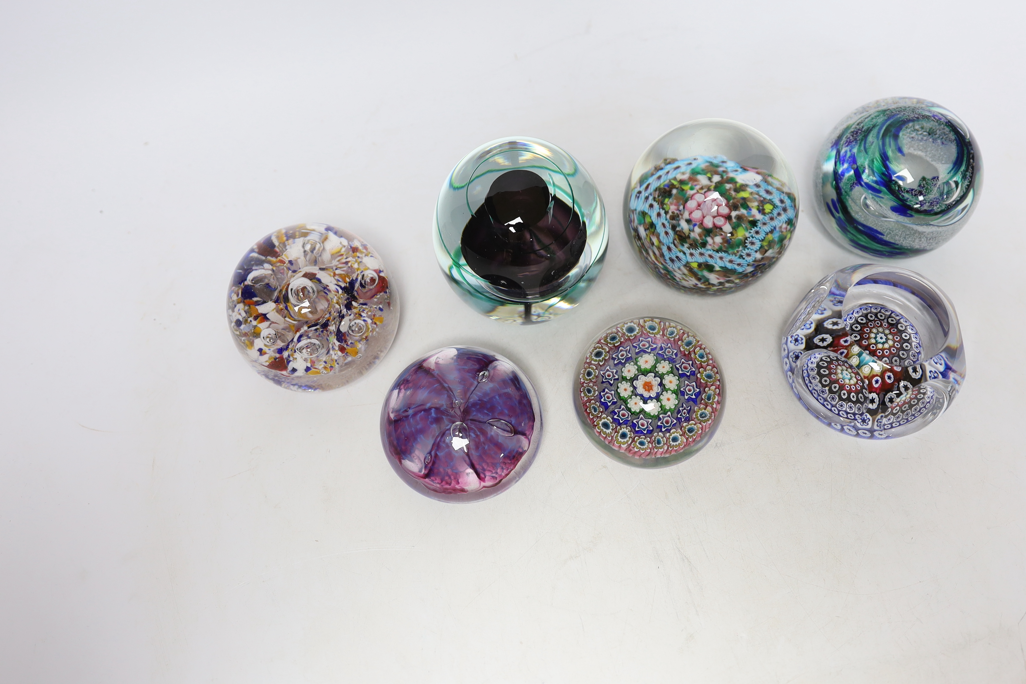 A group of seven Whitefriars and other paperweights, tallest 9cm high